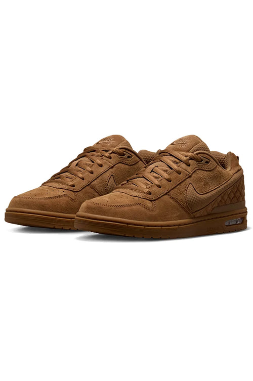 Side profile view of Nike SB Paul Rodriguez Zoom Air Low Light British Tan "Wheat" Skate Shoes highlighting the tonal tan swoosh branding and the low-profile silhouette with reinforced stitching.